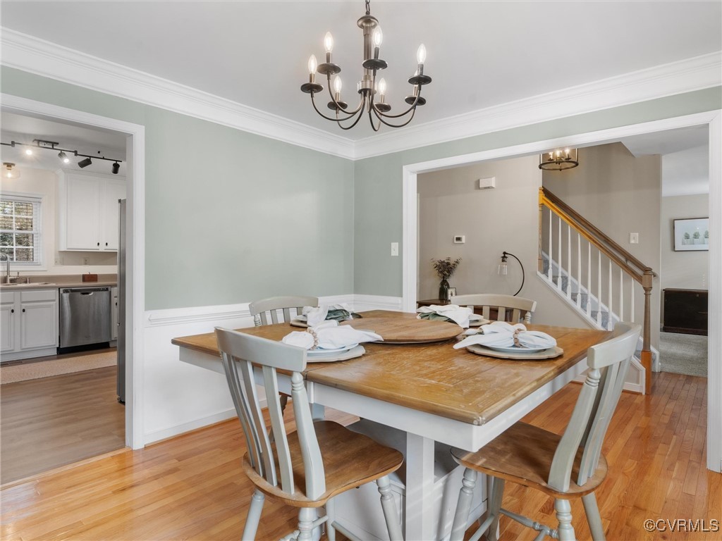 3640 Markey Road Midlothian, VA 23112 - Photo 16 of 42 a view of a dining room with furniture and wooden floor