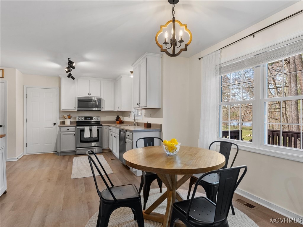 3640 Markey Road Midlothian, VA 23112 - Photo 20 of 42 a view of a dining room with furniture window and wooden floor