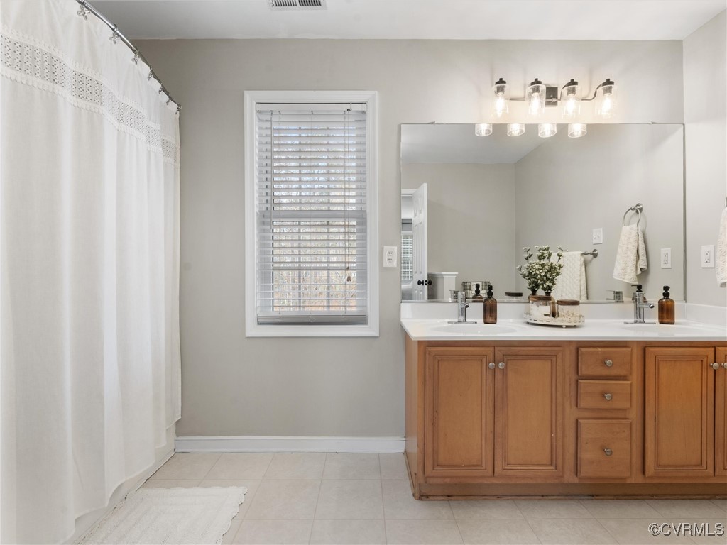 3640 Markey Road Midlothian, VA 23112 - Photo 33 of 42 a bathroom with a sink vanity and a mirror