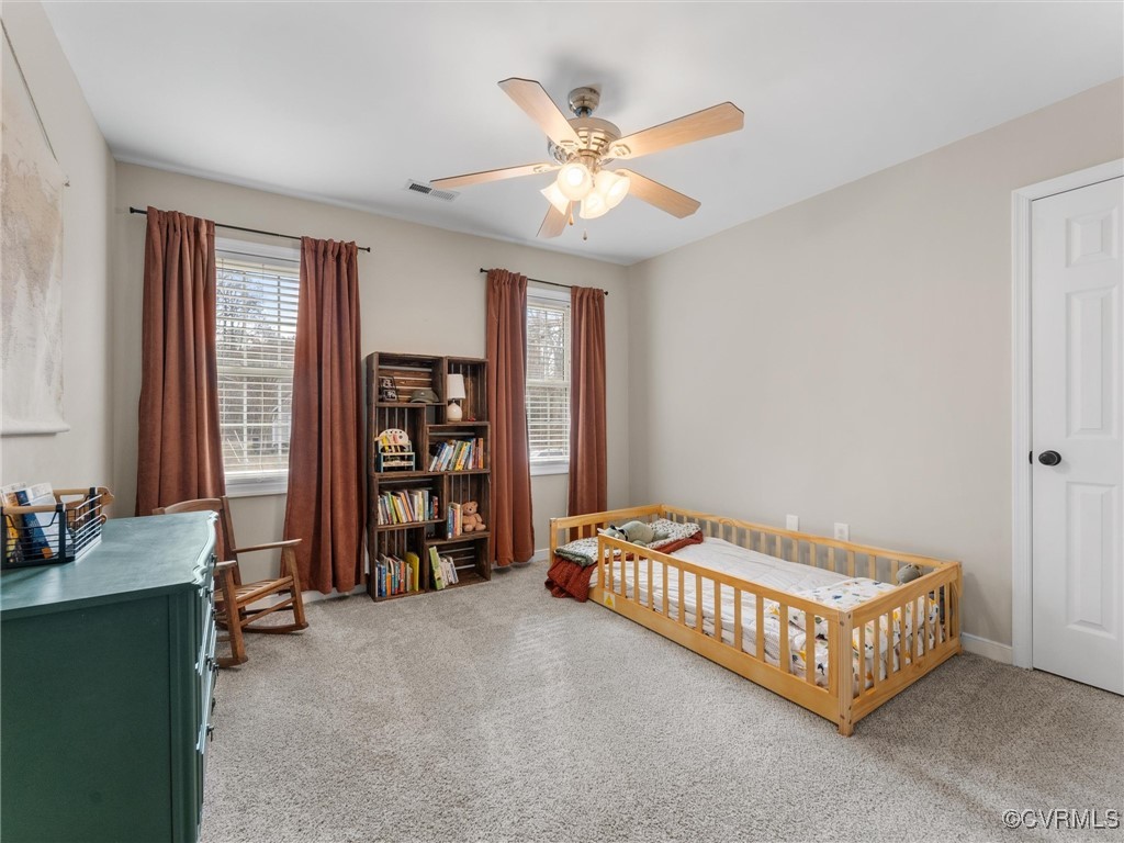 3640 Markey Road Midlothian, VA 23112 - Photo 38 of 42 a bedroom with a bed and a chandelier