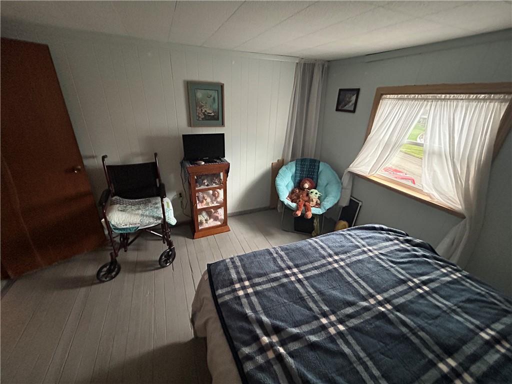 629 South Summit Street Derry, PA 15627 - Photo 19 of 30 a bedroom with a bed and a chandelier