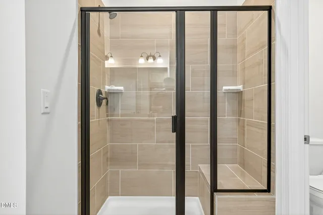 a view of a patio with table and chairs under an umbrella