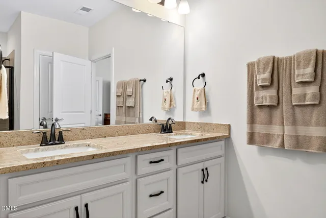 a view of a street with houses in back