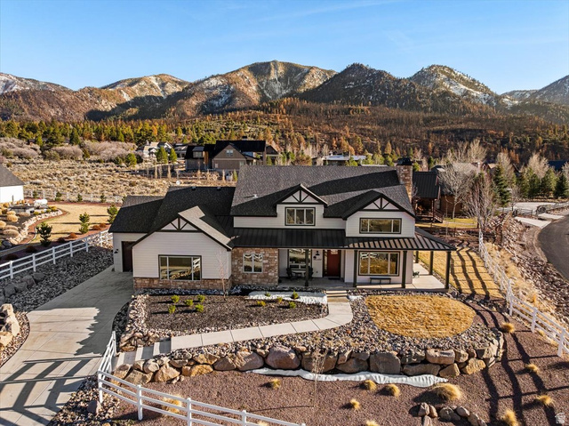 1210 East Bristle Cone Road Pine Valley, UT 84781 - Photo 49 of 54 View of front of property with covered porch, a mountain view, a standing seam roof, and a chimney