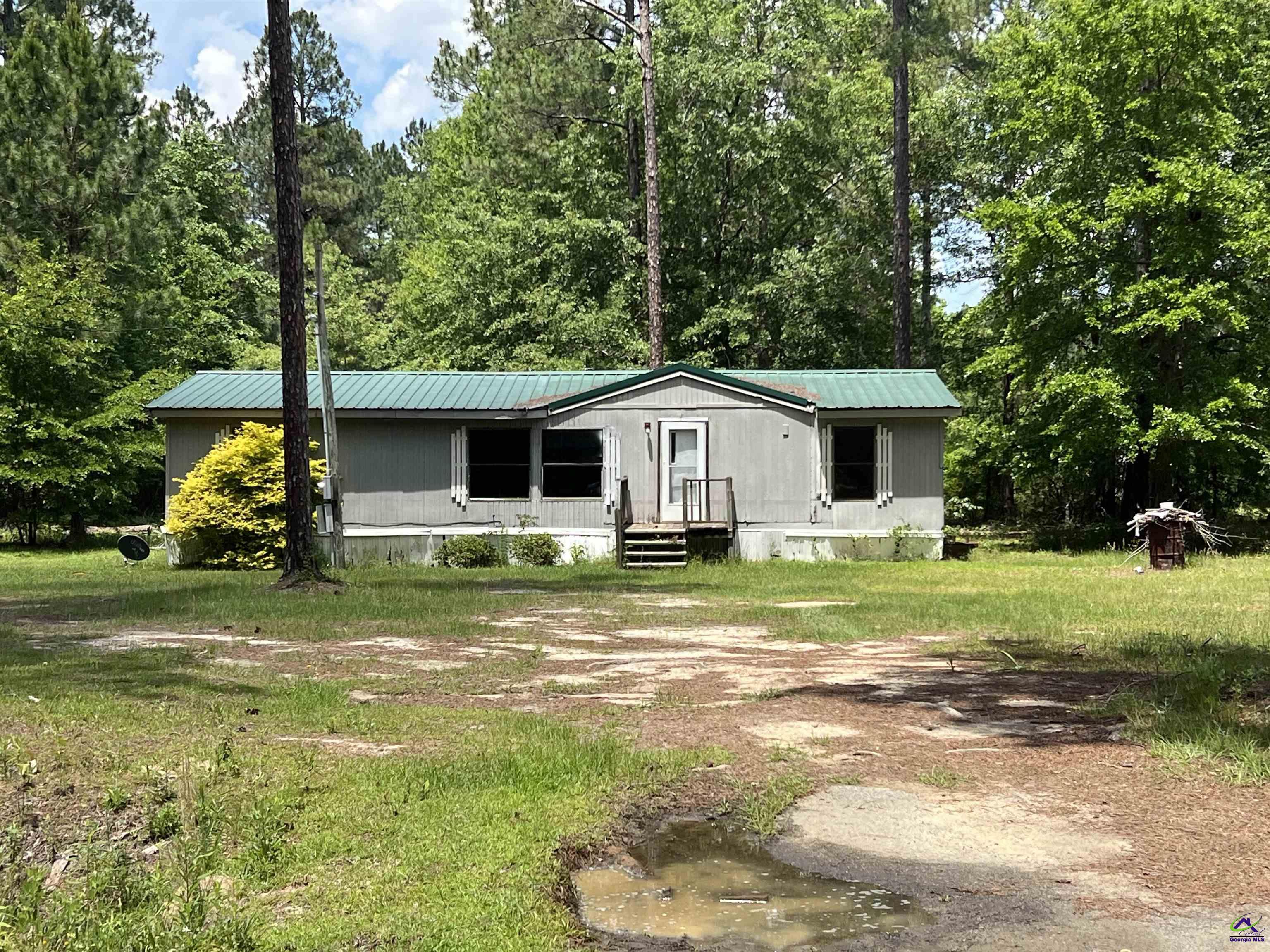 Rock Hill Road Cochran, GA 31014 - Photo 10 of 26 a front view of a house with a yard