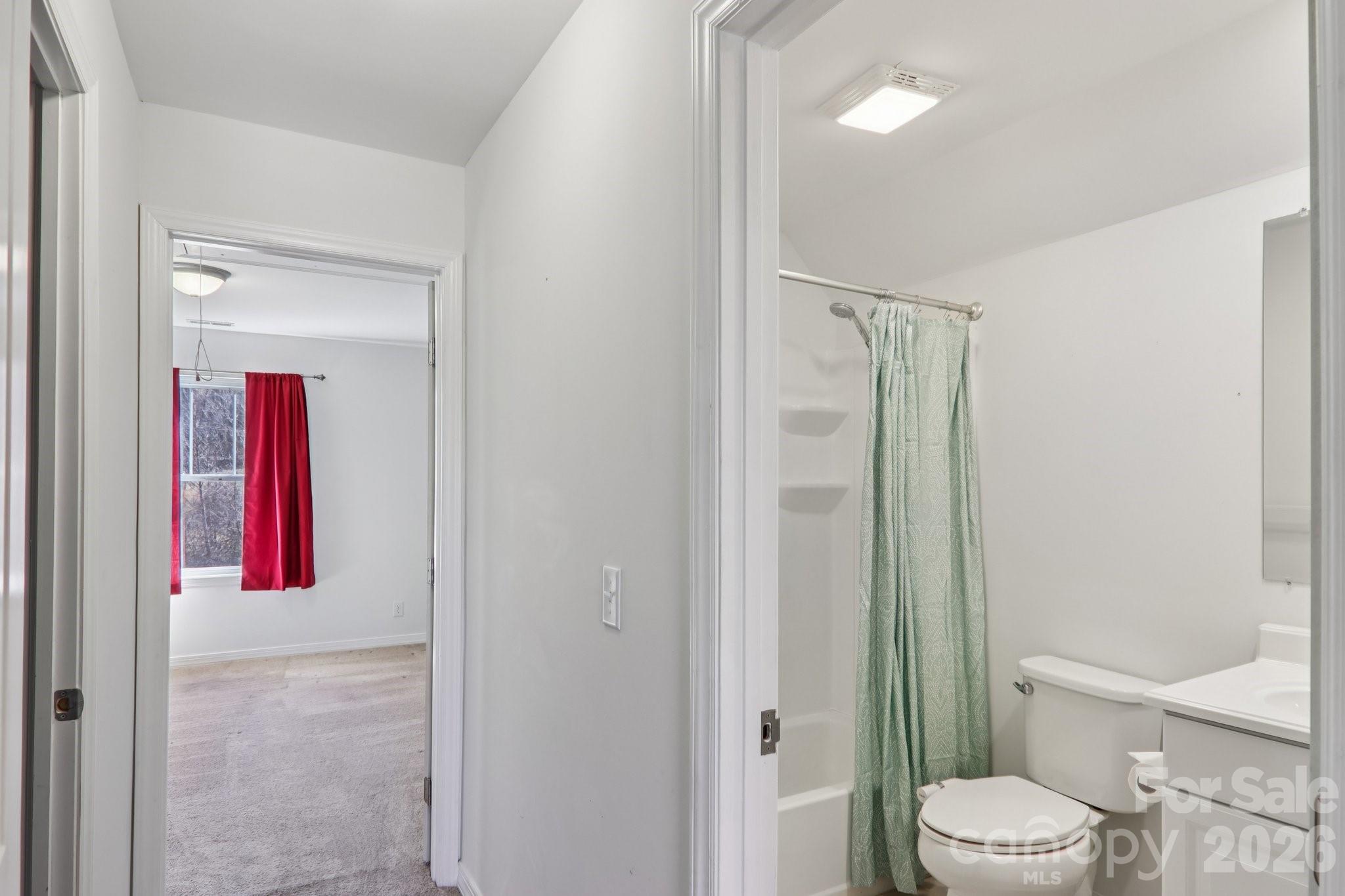 751 Hutch Mountain Road Fletcher, NC 28732 - Photo 32 of 48 a bathroom with a toilet and a shower