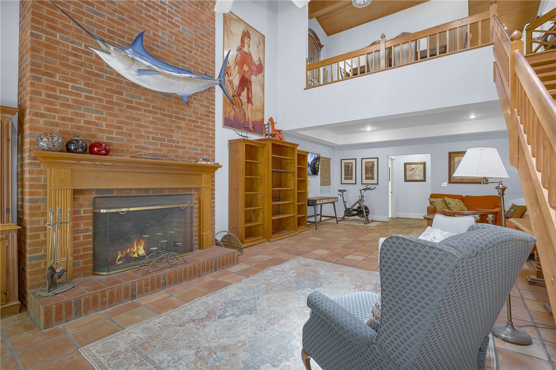 218 Northridge Drive Anderson, SC 29621 - Photo 14 of 50 Warm brick hearth anchors this inviting living area with a grand staircase and overhead balcony.