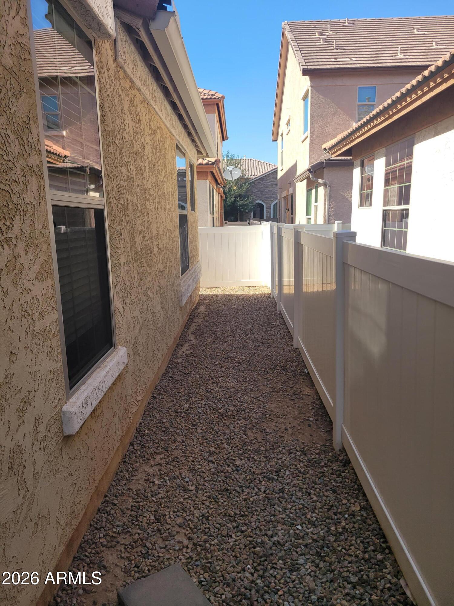 1453 South Sinova Avenue Gilbert, AZ 85296 - Photo 42 of 46 a view of a pathway of a house