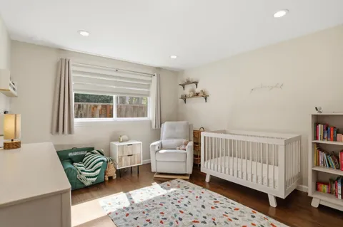 a bedroom with furniture and a window