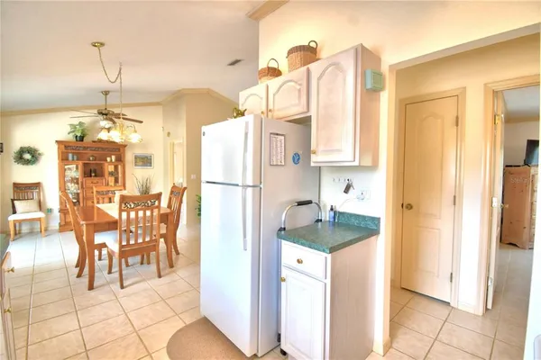 a kitchen with a refrigerator and countertop