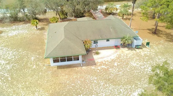 a aerial view of a house with a yard