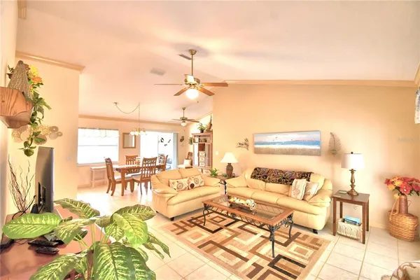 a living room with lots of furniture and a rug