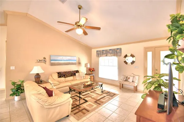 a living room with furniture and a large window