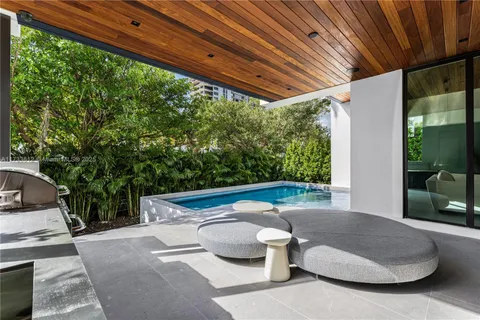 a view of swimming pool with outdoor seating