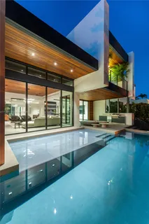 a kitchen with a table and chairs