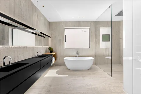 a bathroom with a bathtub sink and toilet
