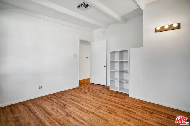 a bathroom with a granite countertop sink and a bathtub