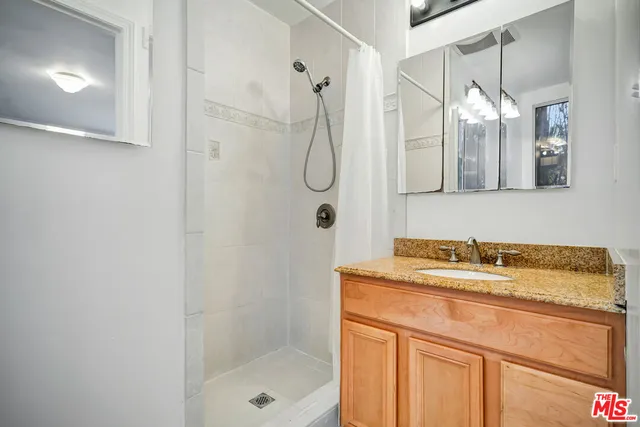 a view of a house with a yard and roof