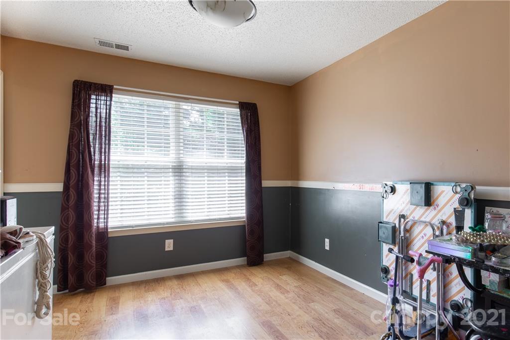 1268 Winding Path Road Clover, SC 29710 - Photo 7 of 19 a view of an empty room with room window and a ceiling fan