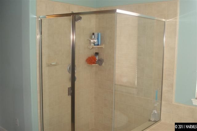 14040 Tagor Road Reno, NV 89521 - Photo 13 of 13 a bathroom with a shower and a glass door