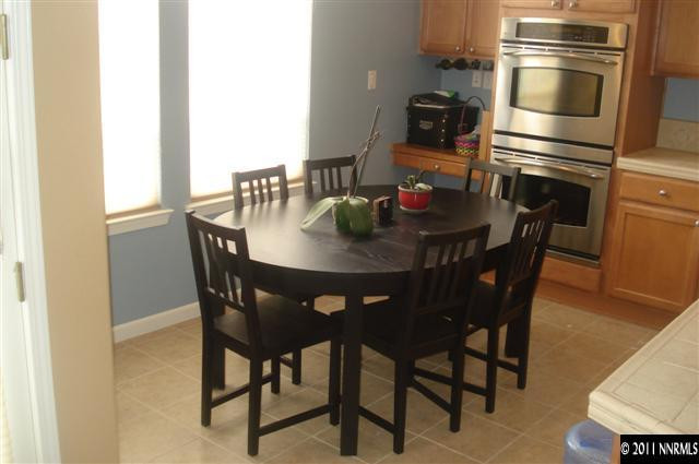 14040 Tagor Road Reno, NV 89521 - Photo 4 of 13 a view of a dining room with furniture and wooden floor