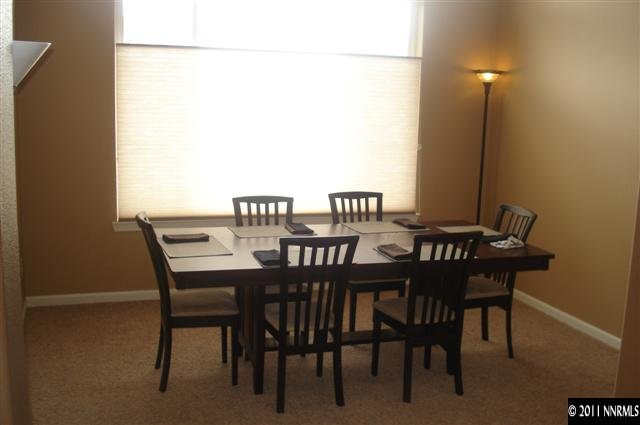 14040 Tagor Road Reno, NV 89521 - Photo 5 of 13 a view of a dining room with furniture and a window