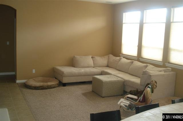 14040 Tagor Road Reno, NV 89521 - Photo 6 of 13 a living room with furniture and a window