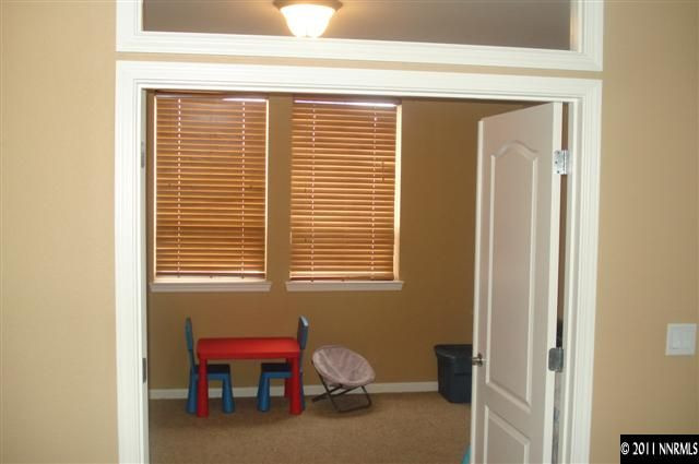 14040 Tagor Road Reno, NV 89521 - Photo 9 of 13 a livingroom with window and a chair