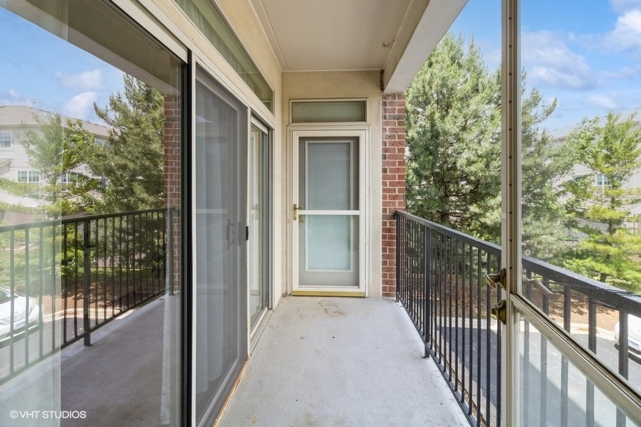 3135 Town Square Drive, Unit 106 Rolling Meadows, IL 60008 - Photo 17 of 20 a view of a balcony