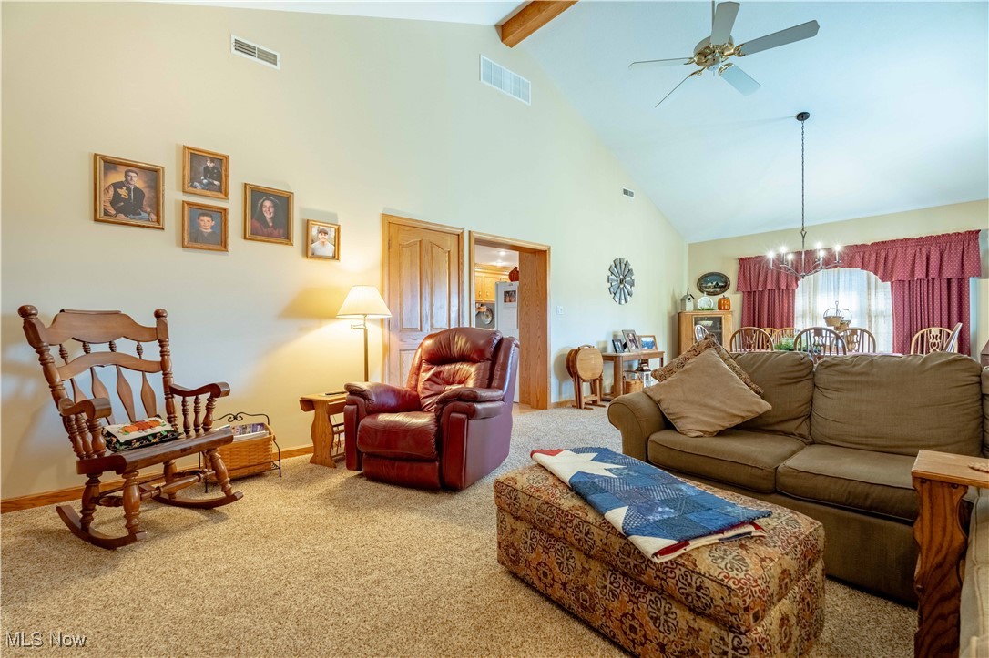 90480 Kilgore Ridge Road Scio, OH 43988 - Photo 12 of 39 Carpeted living area with high vaulted ceiling, beam ceiling, a chandelier, and a ceiling fan