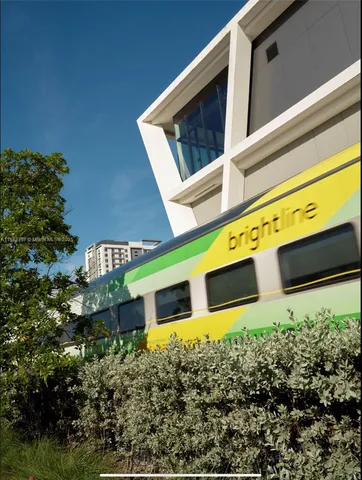 a front view of a building with garden
