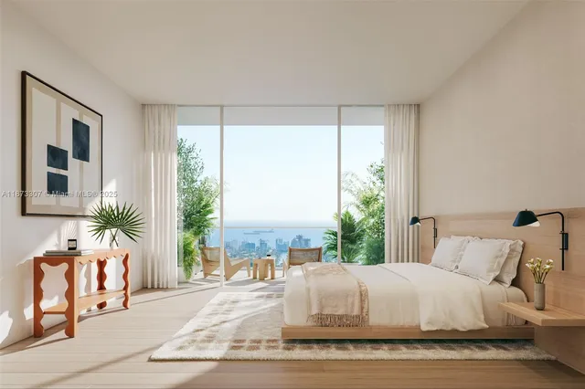 a bed sitting in a bedroom next to a window