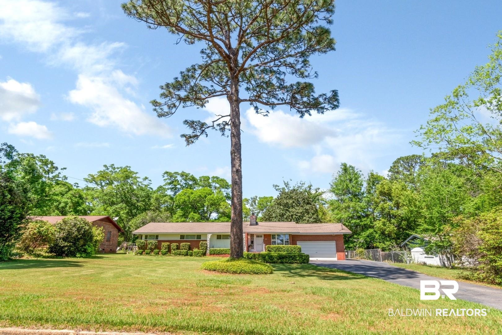 6300 Woodcrest Drive Mobile, AL 36608 - Photo 35 of 35 Single story home with driveway, fence, an attached garage, and a front lawn