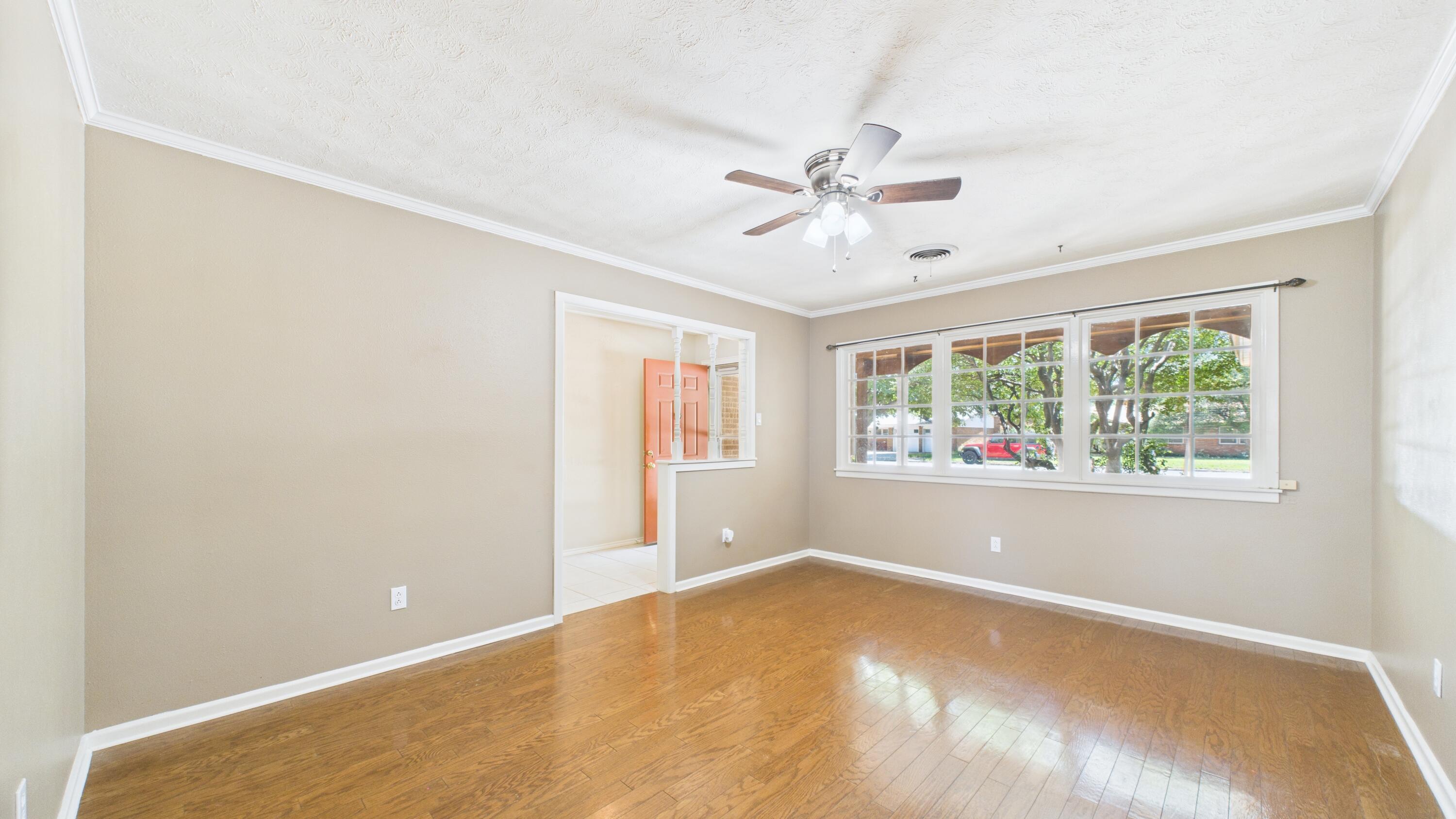3022 67th Street Lubbock, TX 79413 - Photo 12 of 42 a view of an empty room with a window