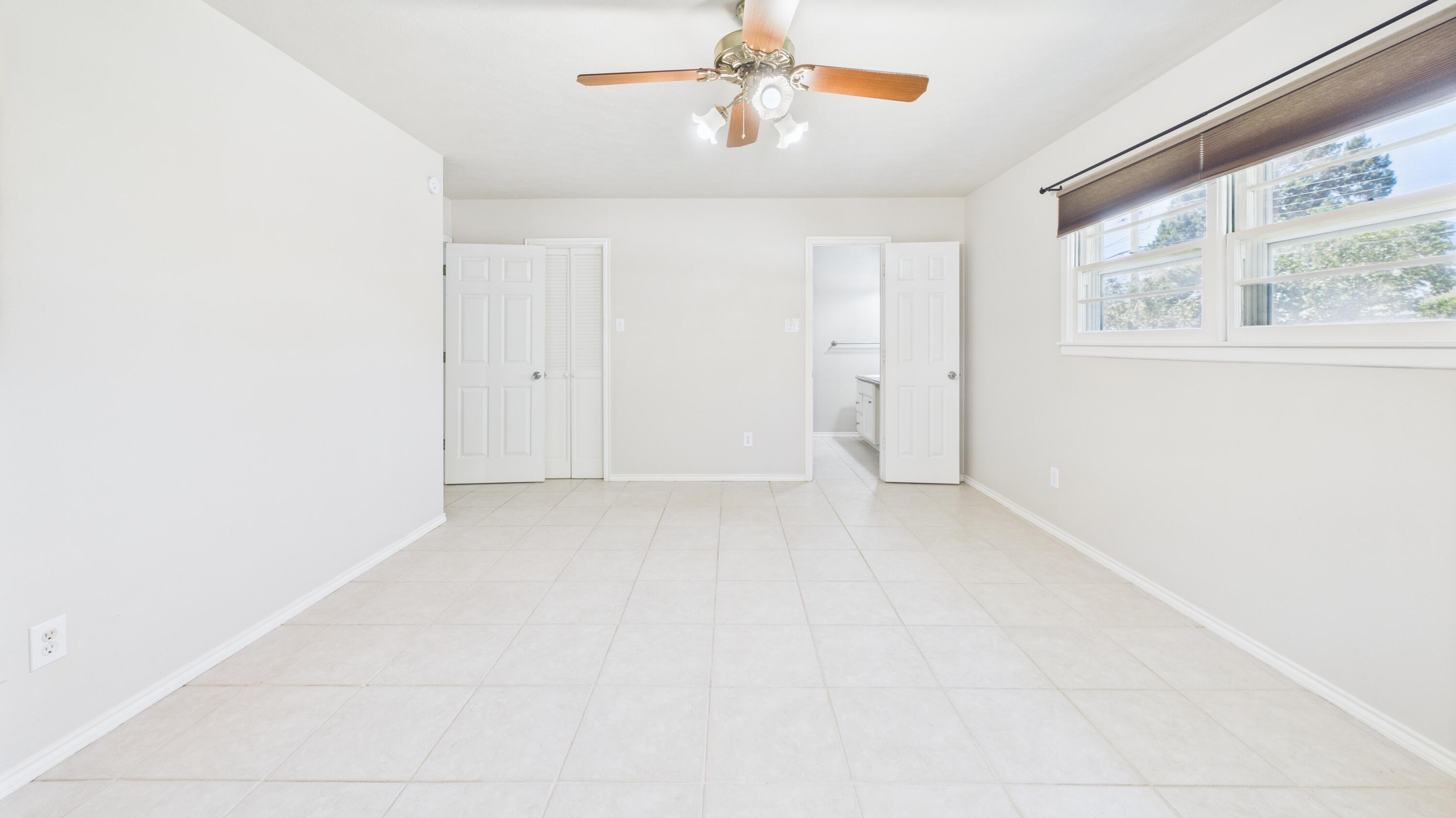 3022 67th Street Lubbock, TX 79413 - Photo 28 of 42 a view of a livingroom with a ceiling fan and window