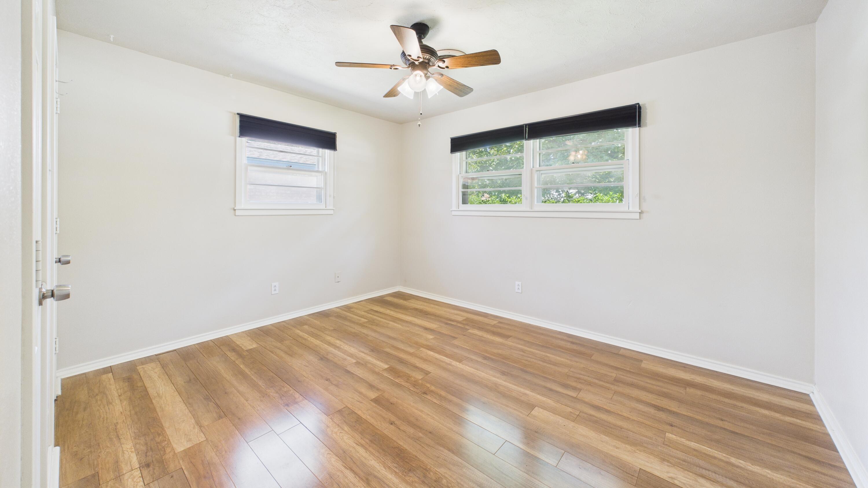 3022 67th Street Lubbock, TX 79413 - Photo 33 of 42 a view of empty room with window and ceiling fan