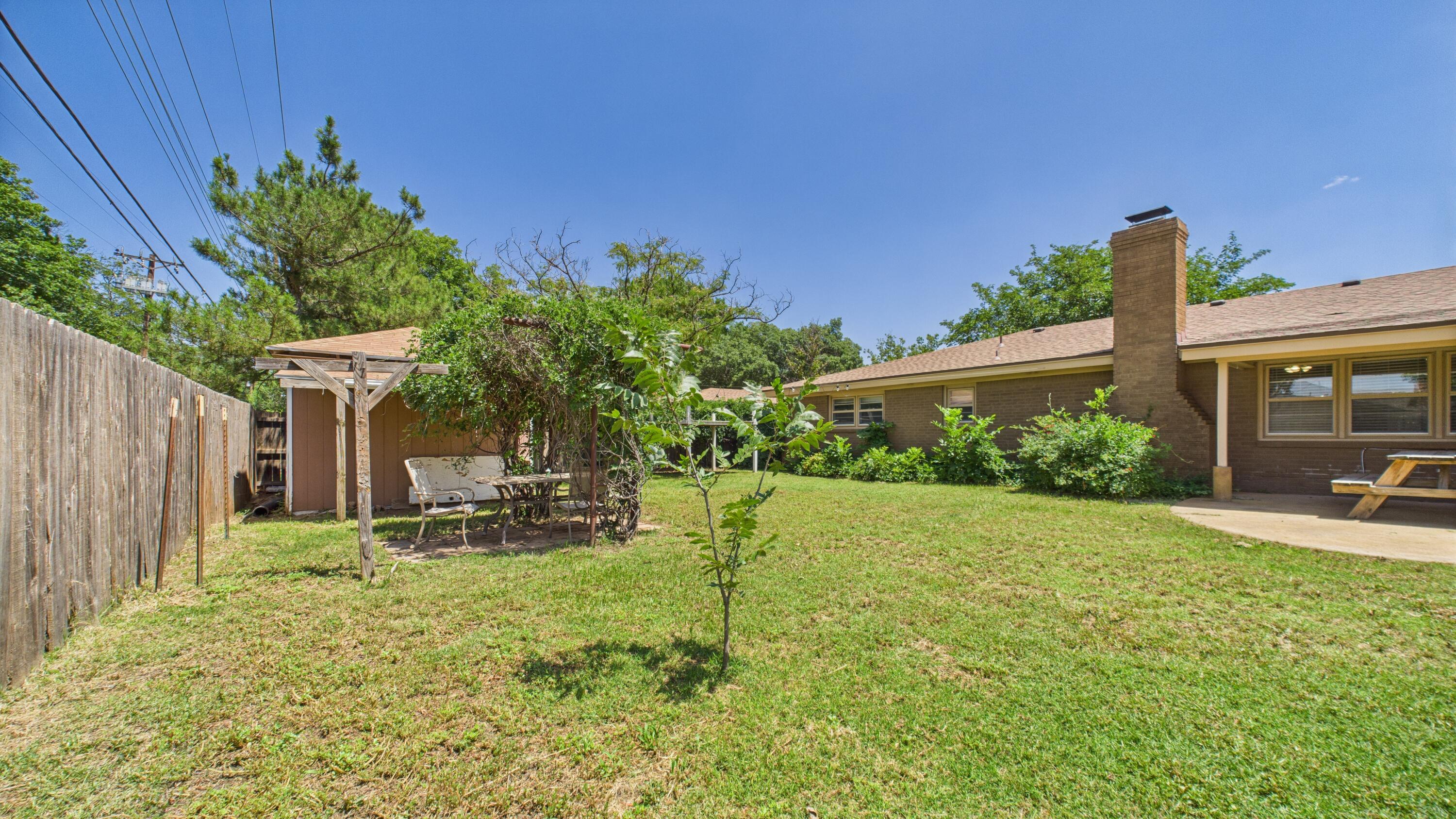 3022 67th Street Lubbock, TX 79413 - Photo 38 of 42 a view of a house with backyard and sitting area