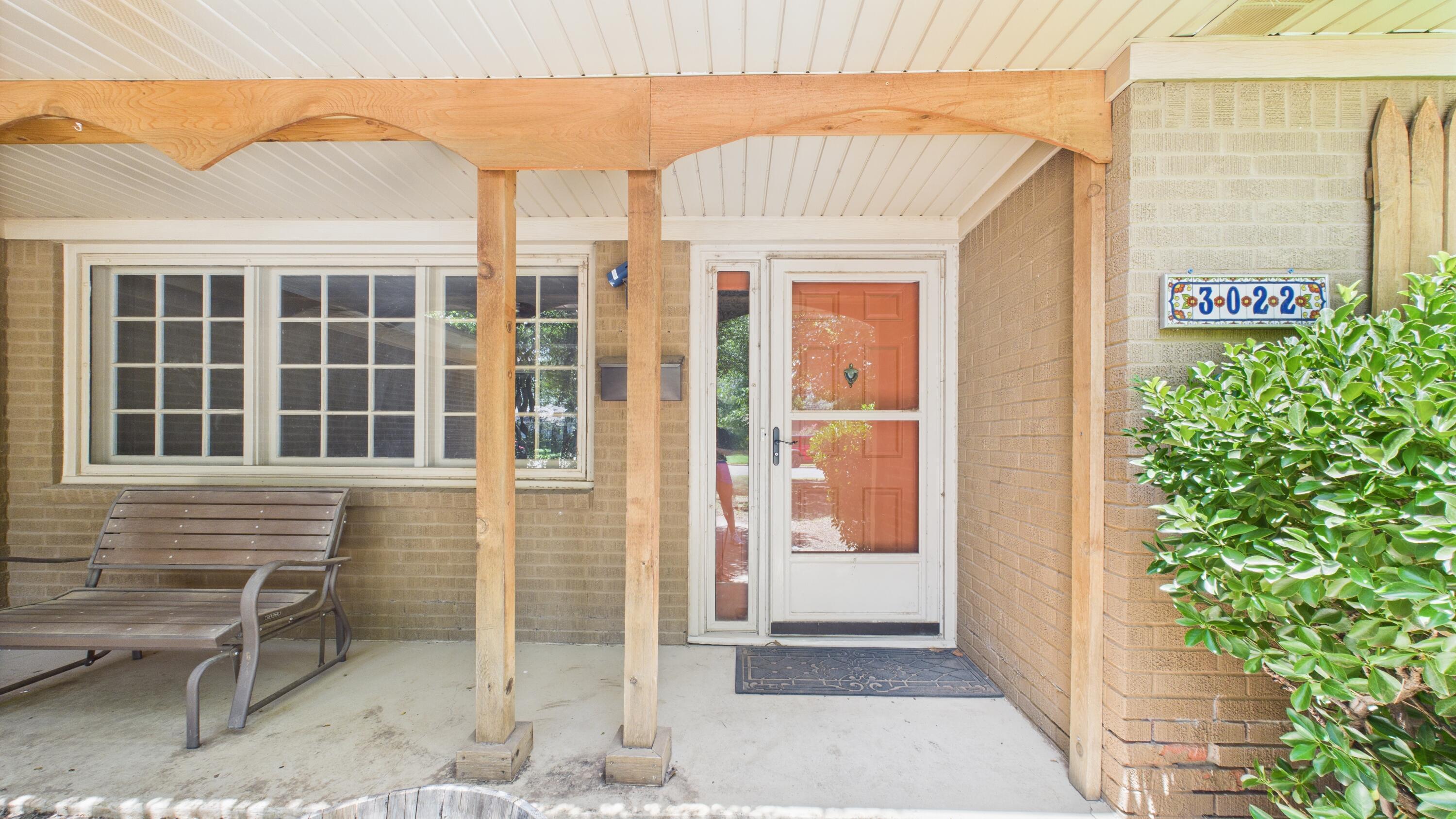 3022 67th Street Lubbock, TX 79413 - Photo 8 of 42 a front view of a house with a yard