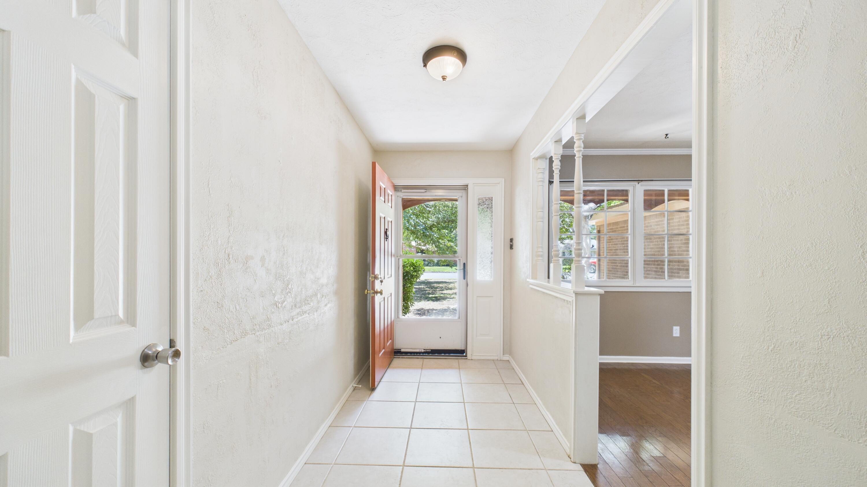 3022 67th Street Lubbock, TX 79413 - Photo 9 of 42 a view of an entryway with kitchen