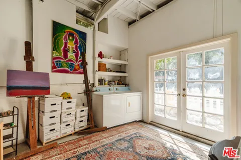 a view of an entryway with wooden floor
