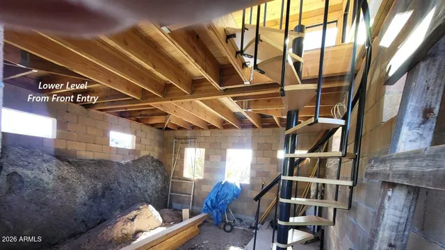 a view of entryway with wooden stairs