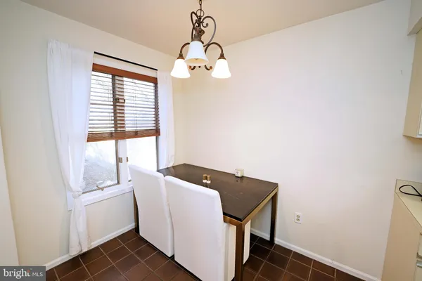 a view of storage and utility room with a window
