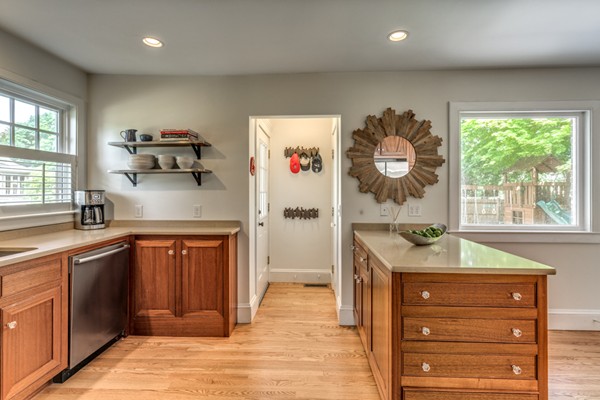 832 Webster Street Needham, MA 02492 - Photo 12 of 28 a kitchen with granite countertop a refrigerator and a sink
