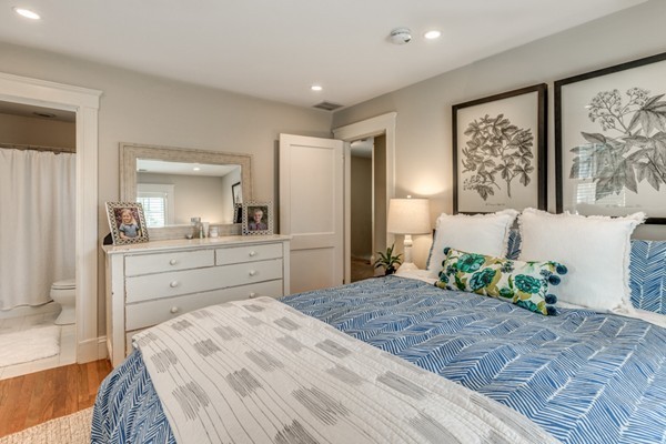 832 Webster Street Needham, MA 02492 - Photo 18 of 28 a bedroom with a large bed and a dresser