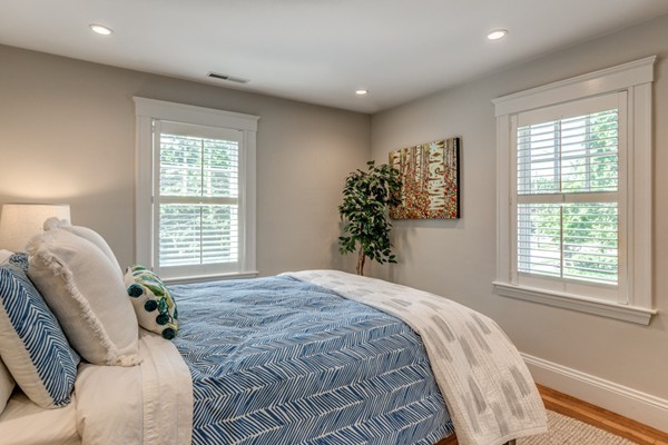 832 Webster Street Needham, MA 02492 - Photo 19 of 28 a spacious bedroom with a bed and a window