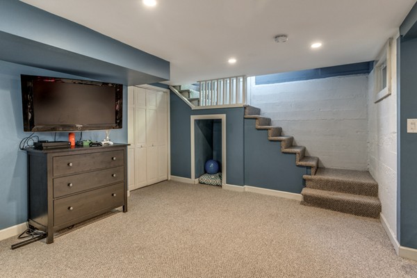 832 Webster Street Needham, MA 02492 - Photo 23 of 28 a room with furniture and a flat screen tv