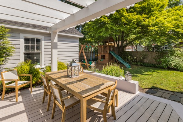 832 Webster Street Needham, MA 02492 - Photo 25 of 28 a view of a patio with table and chairs with wooden floor and fence