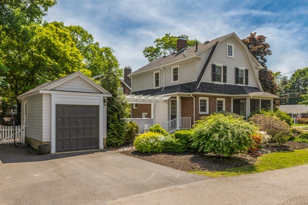 832 Webster Street Needham, MA 02492 - Photo 27 of 28 a front view of a house with a yard and garage