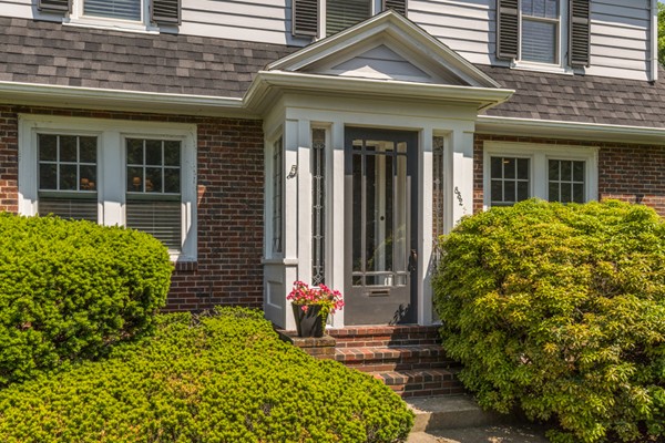 832 Webster Street Needham, MA 02492 - Photo 3 of 28 front view of a house with a small yard