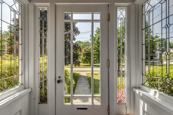 832 Webster Street Needham, MA 02492 - Photo 4 of 28 a view of a glass door with a balcony